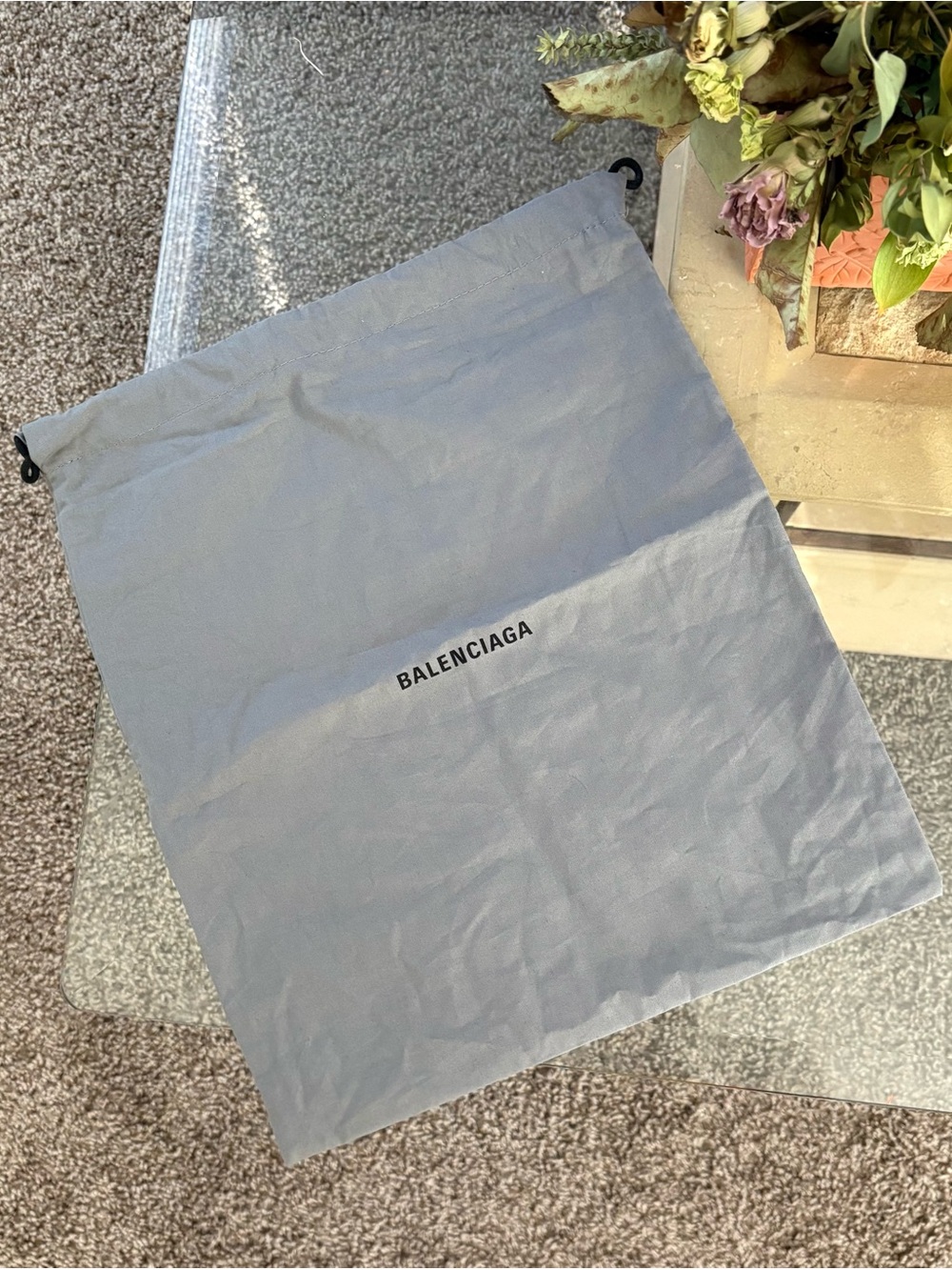 Balenciaga gray logo dust pouch with black lettering
